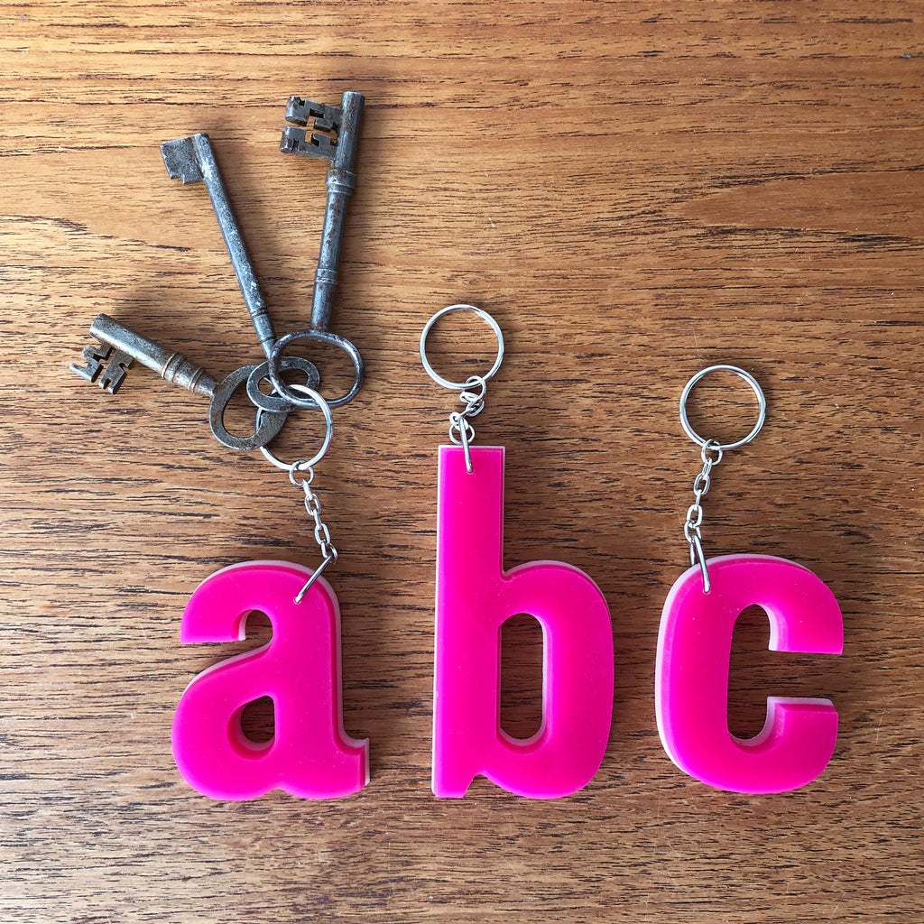 Reclaimed Letter Keyrings - Pink on white Perspex Reclaimed Letter Keyrings - Pink on white Perspex