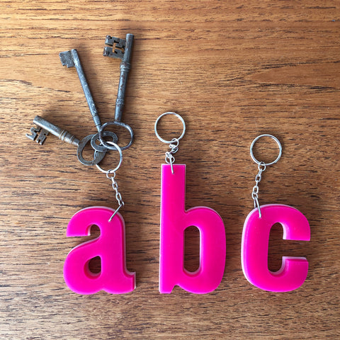 Reclaimed Letter Keyrings - Pink on white Perspex